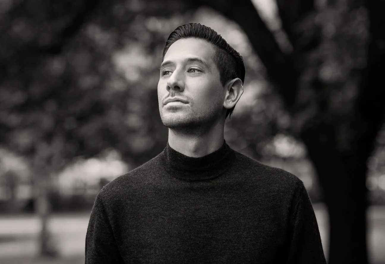 Man in a black merino roll neck