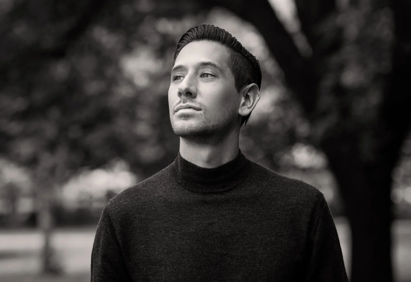 Man in a black merino roll neck