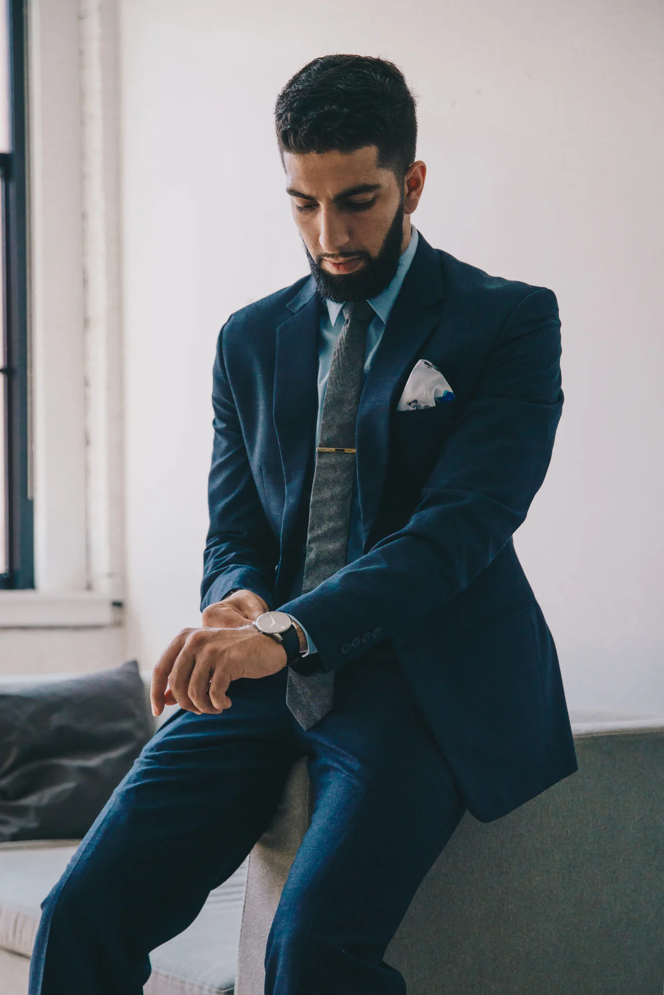 Navy wool trousers worn with the matching jacket